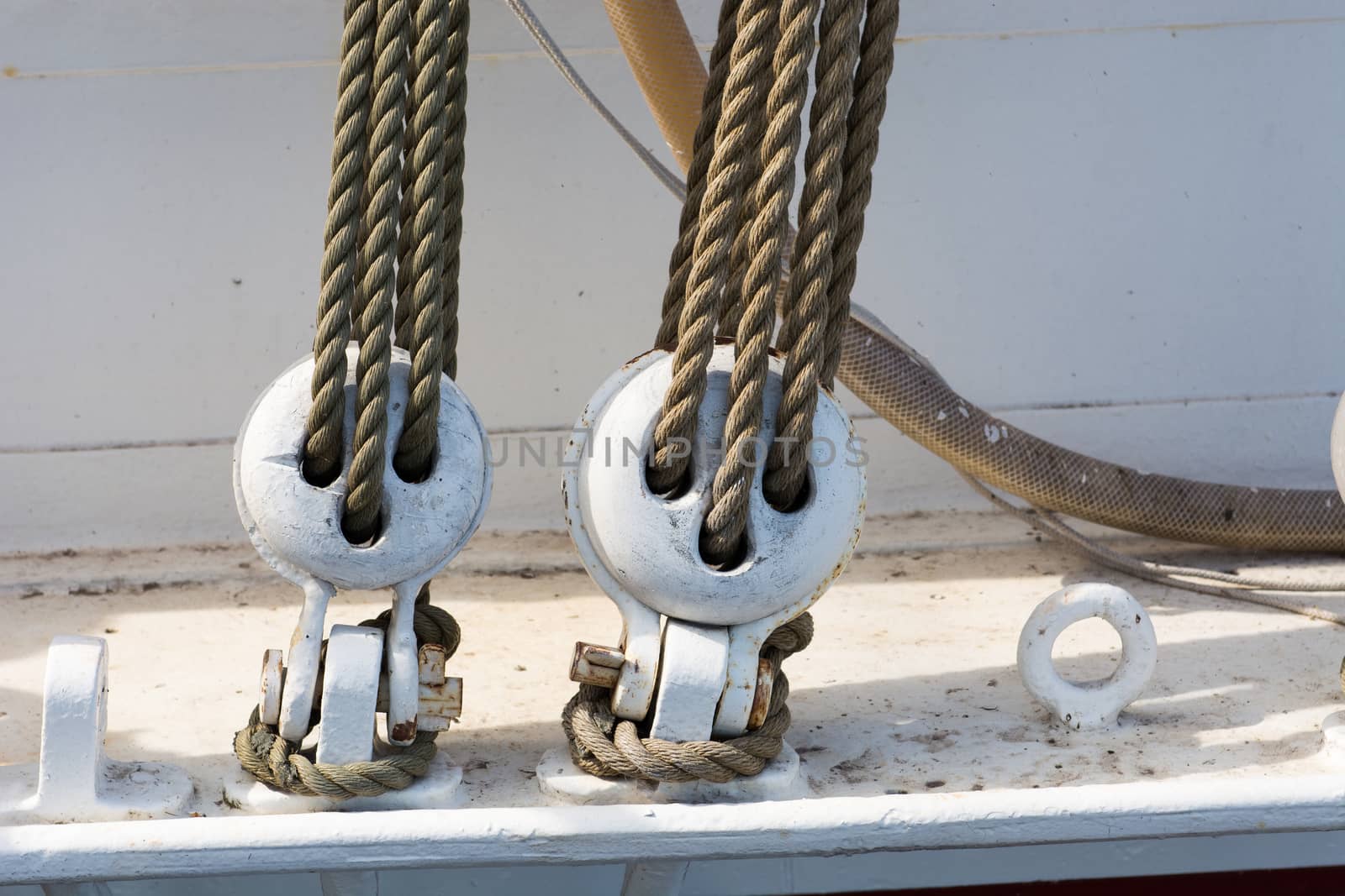Detail of wooden block tackle marine rigs and ropes