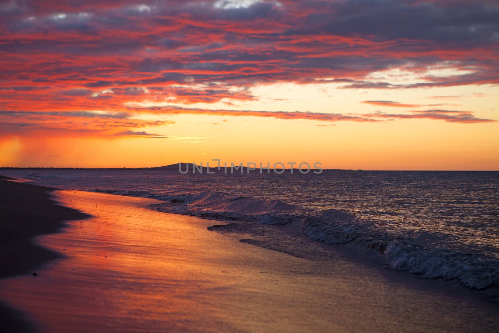 Sunset over the ocean very early in the morning