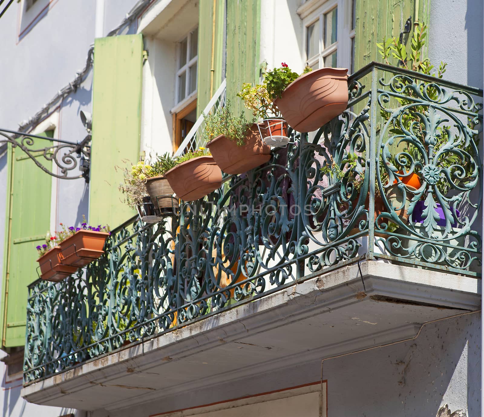 Balcony with hanging flower pot in France