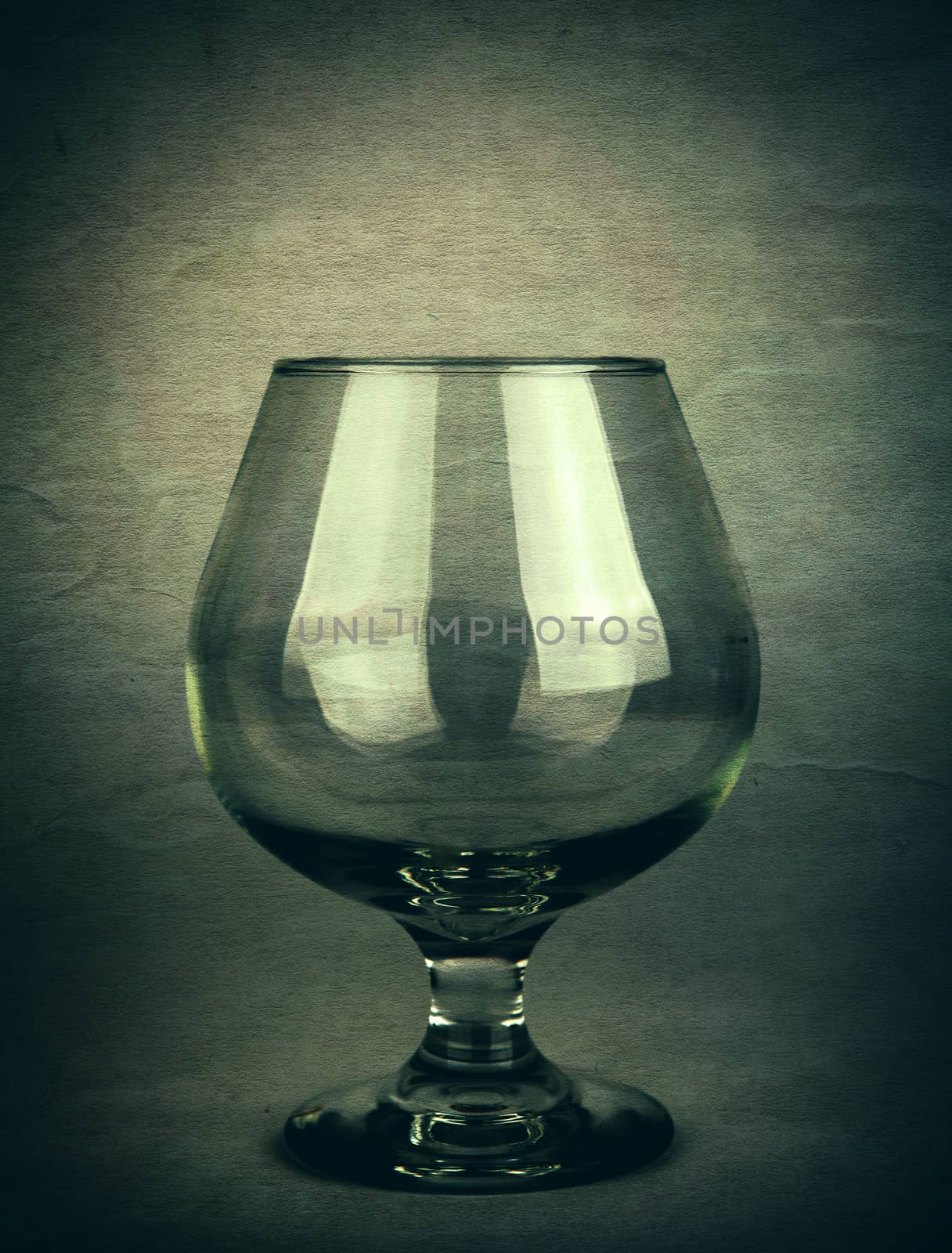 Vintage and Toned Photo of the Glass on Dark Background