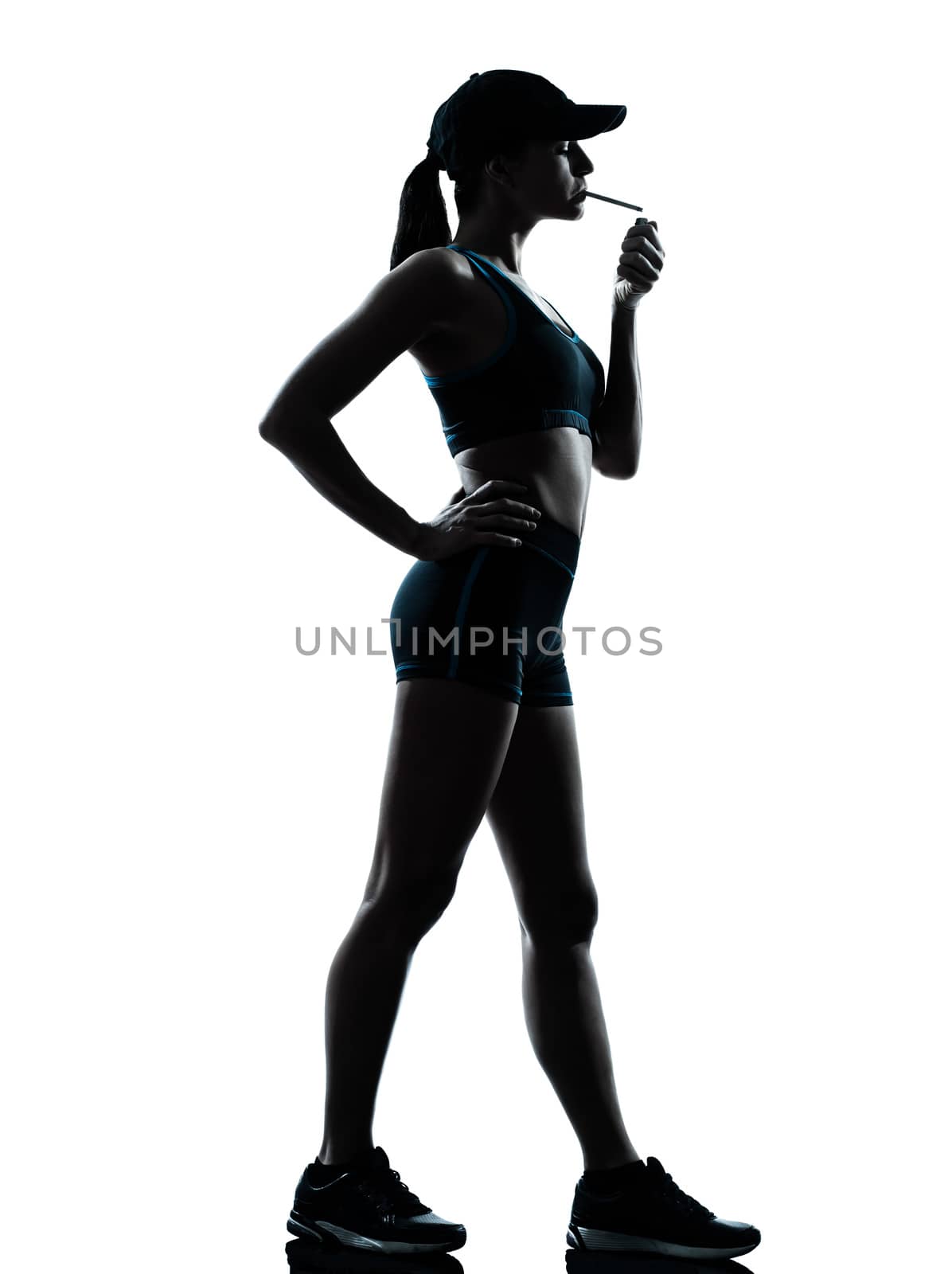 one  woman runner jogger smoking in silhouette studio isolated on white background
