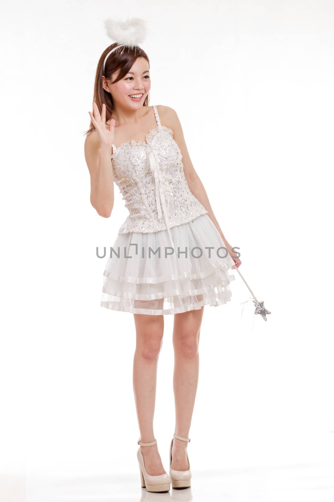 Malay woman in white angel fairy godmother costume