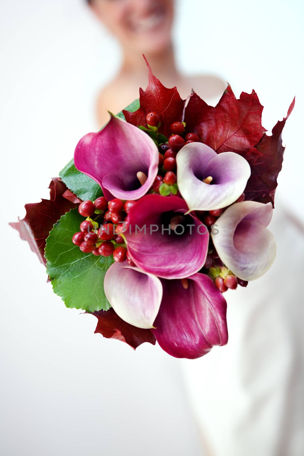 Background girlfriend showing her lovely bouquet of flowers