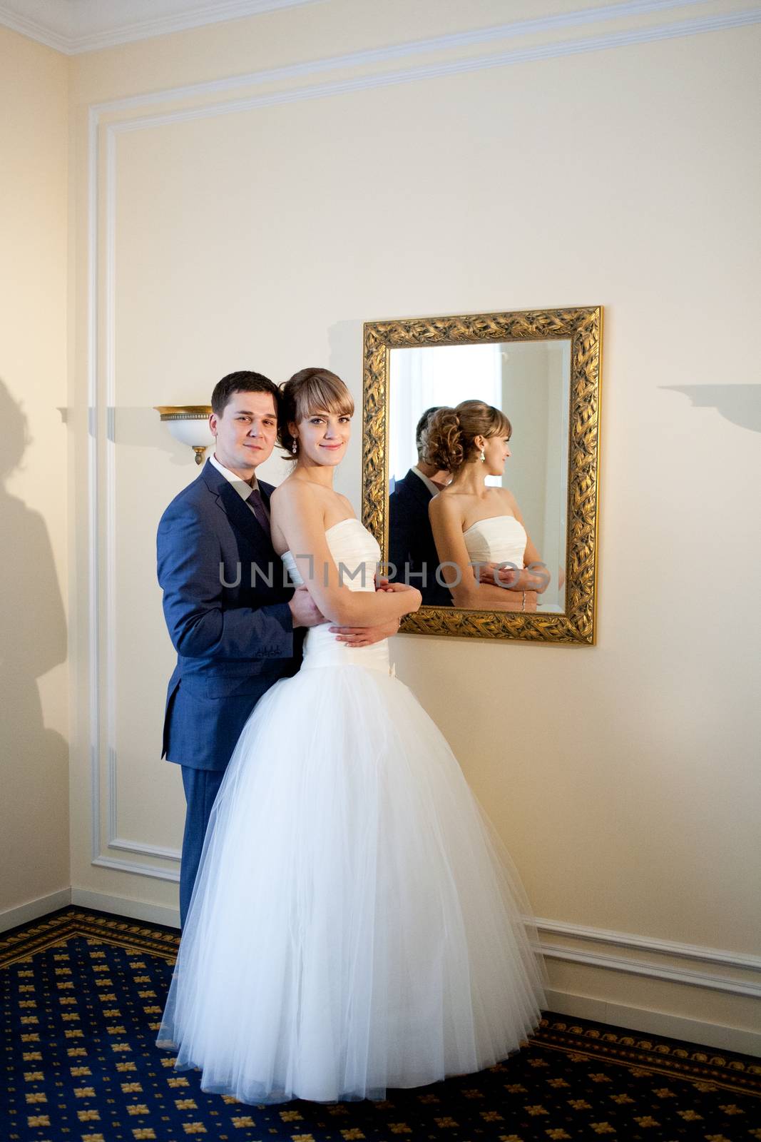 bride and groom by the mirrir by vsurkov