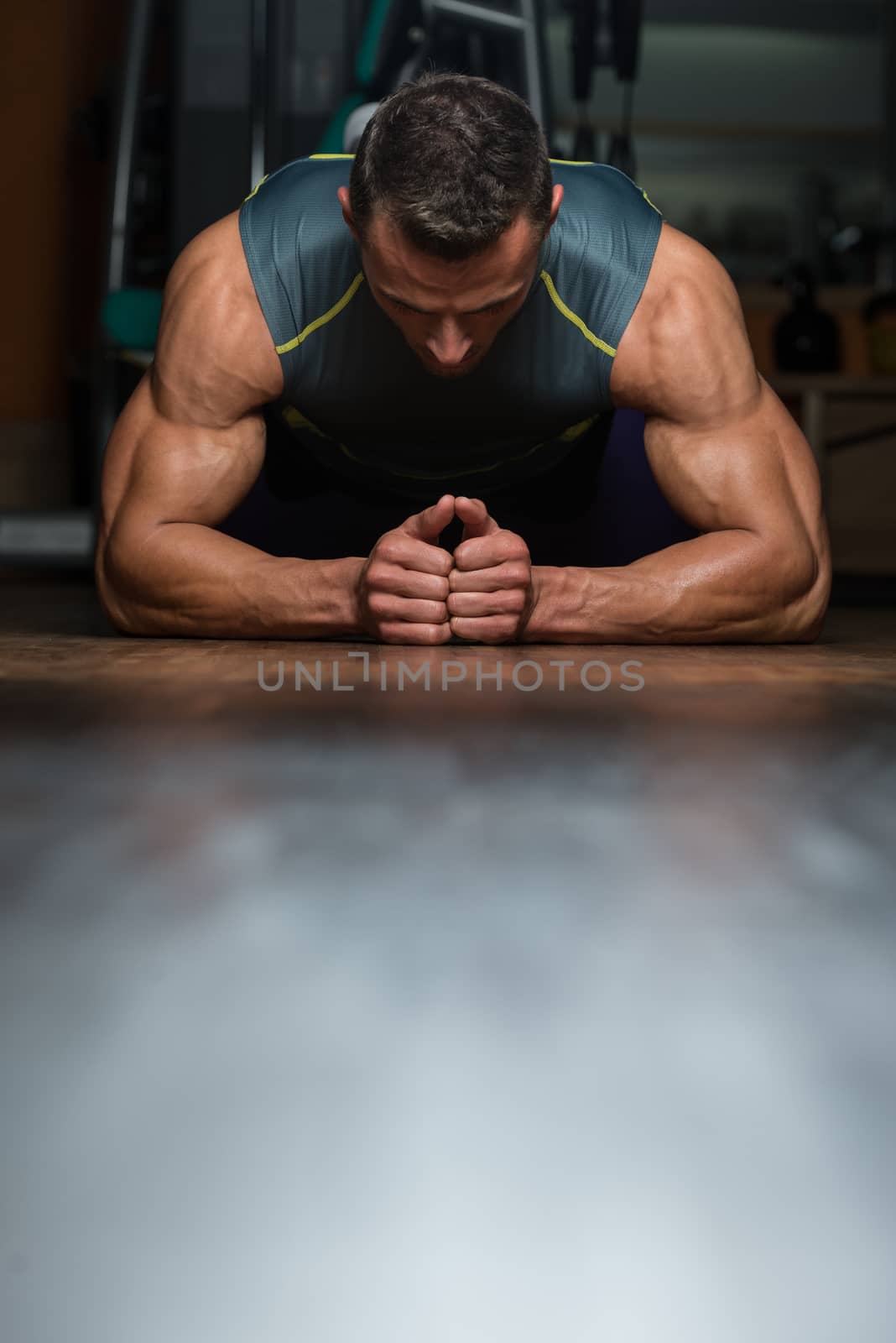 Young Man Doing Press Ups In Gym by JalePhoto