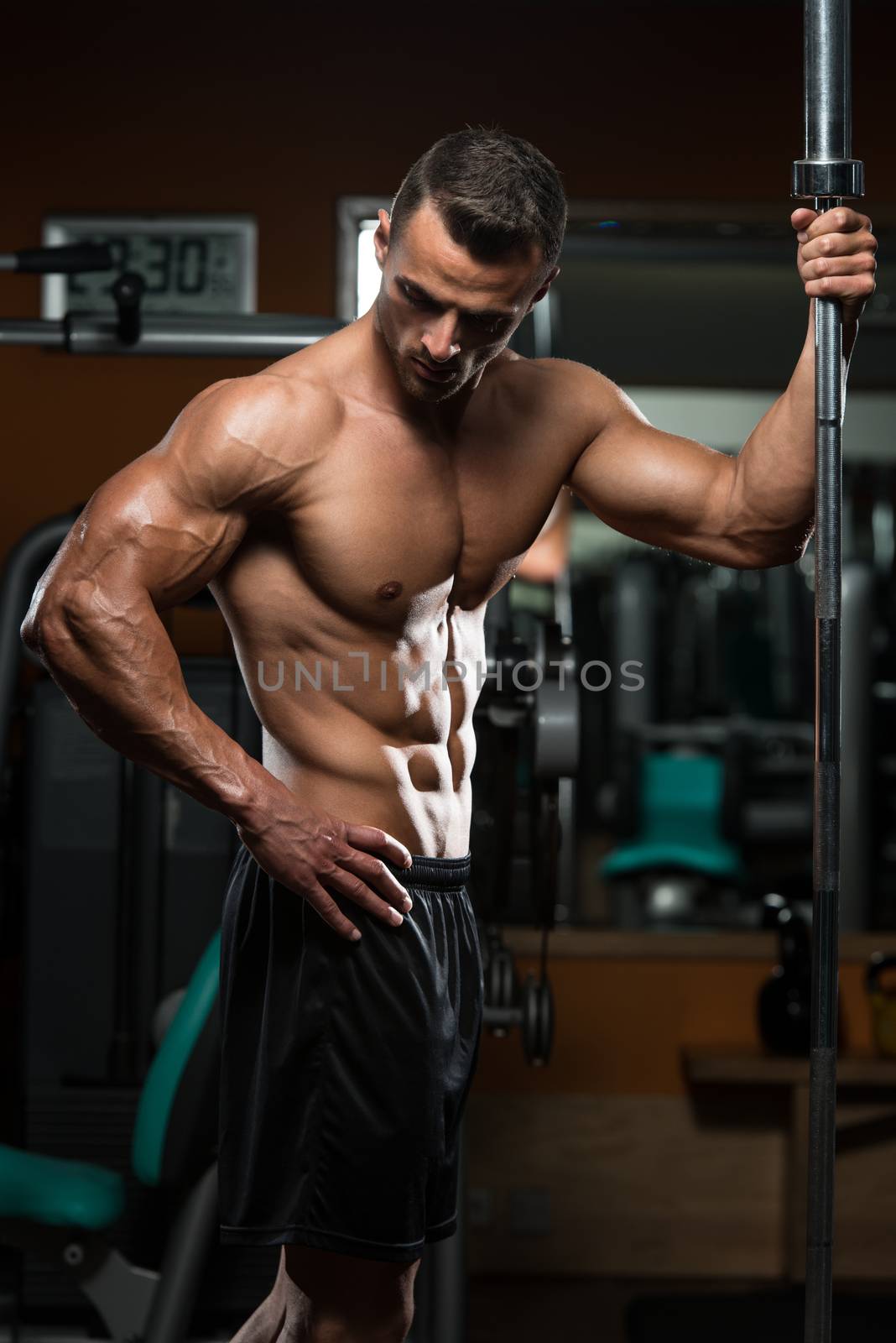 Sexy Muscular Man Rest After Exercises by JalePhoto