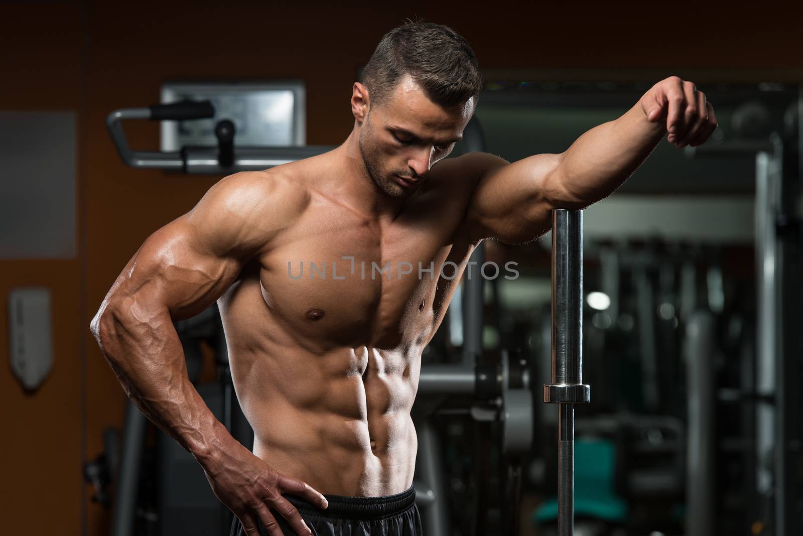 Young Muscular Men Resting After Exercises by JalePhoto