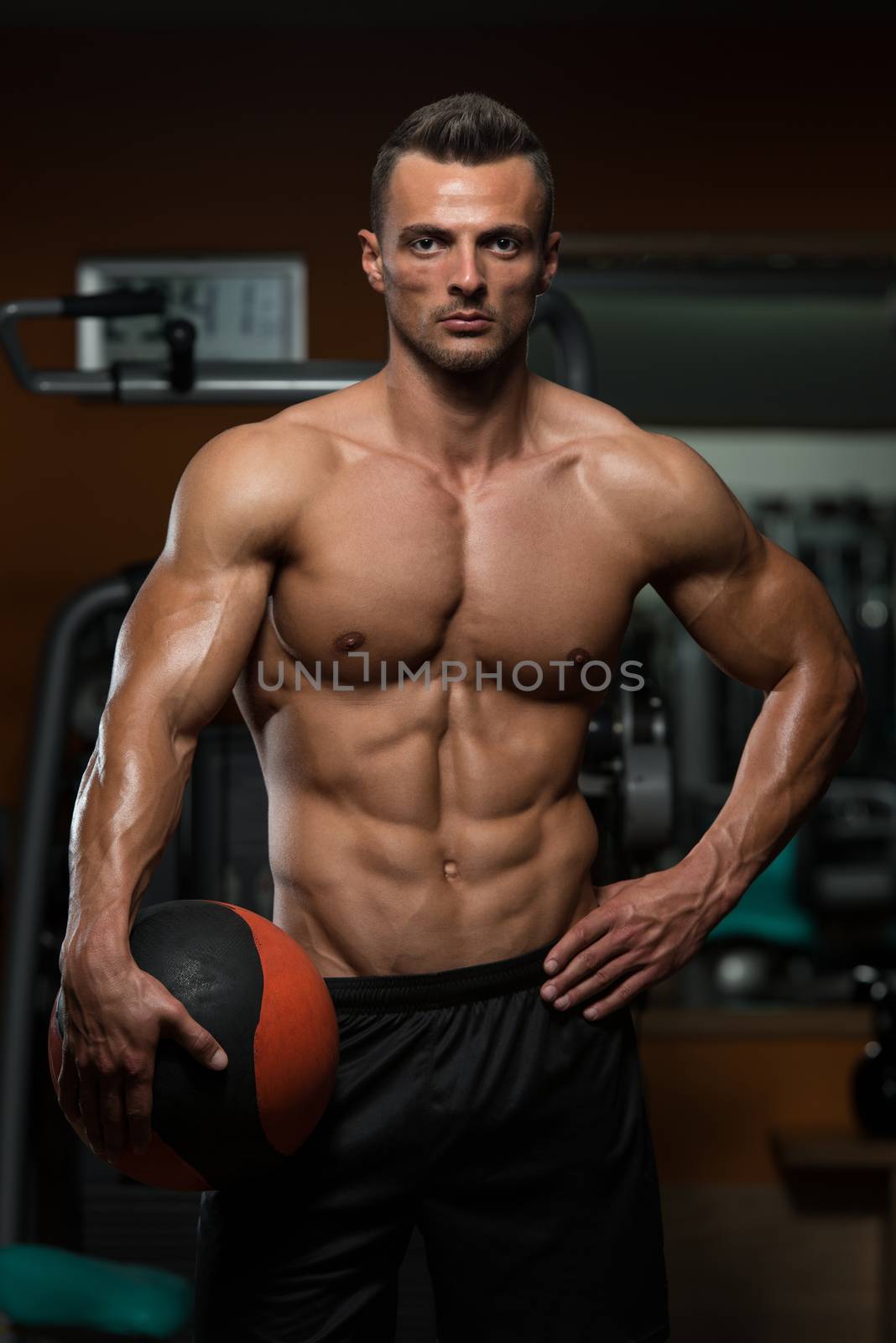 Athletic Man Workout With Medical Ball by JalePhoto