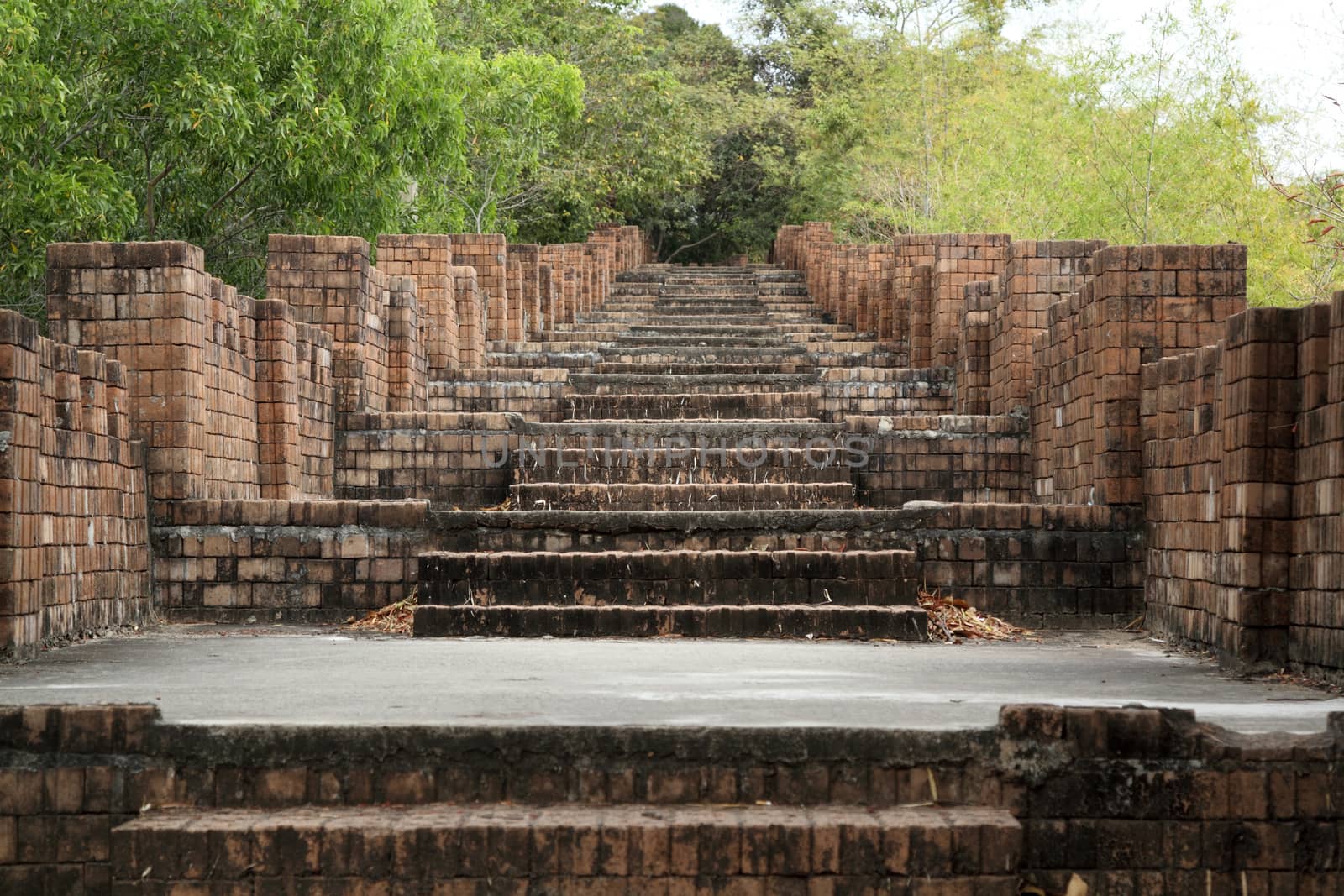 Path stone brick stairs at go to temple in Thailand