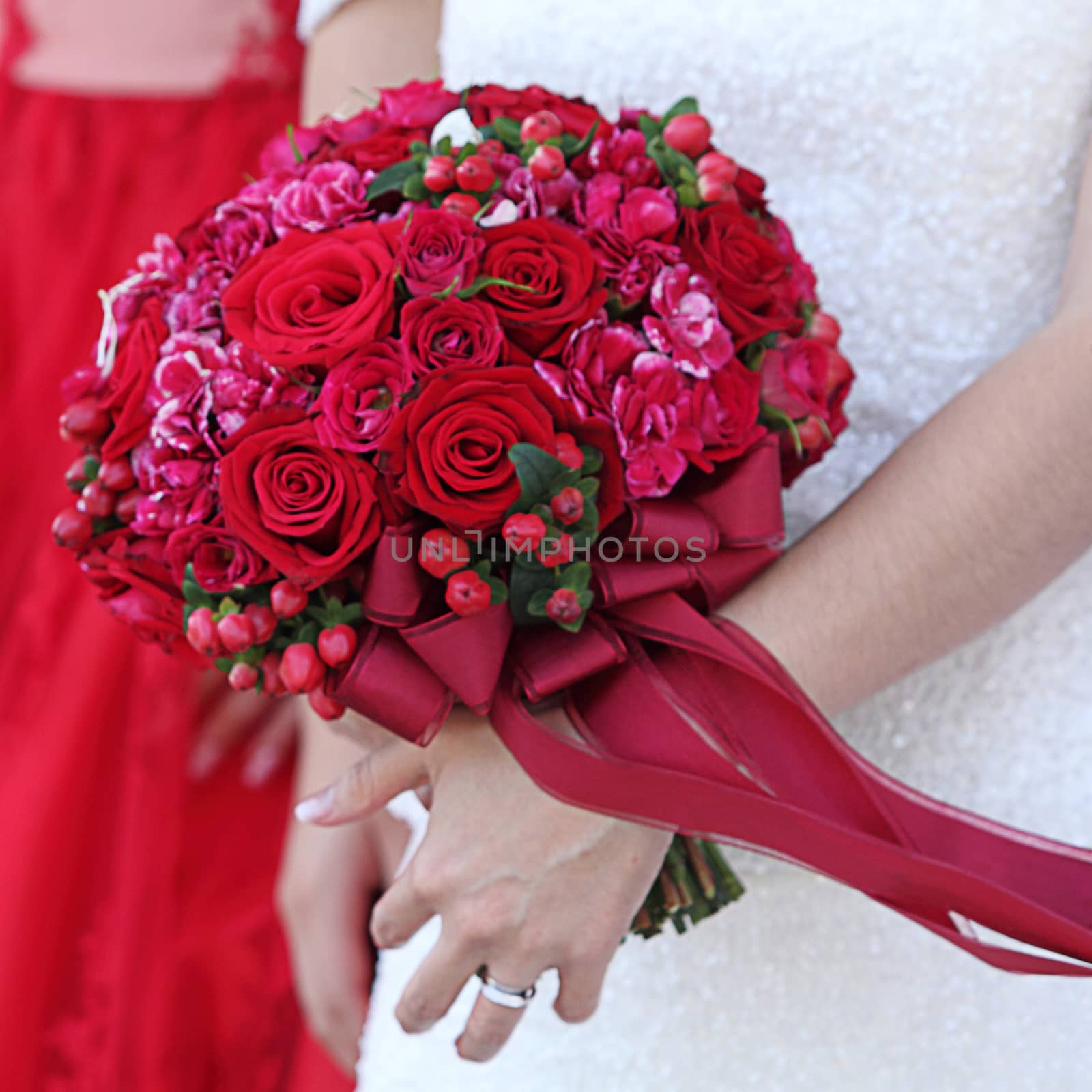 Wedding bouquet in hands of the bride