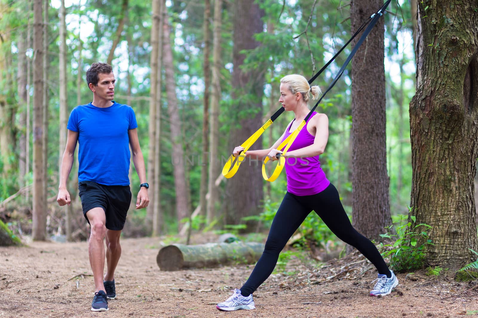 Training with fitness straps outdoors. by kasto