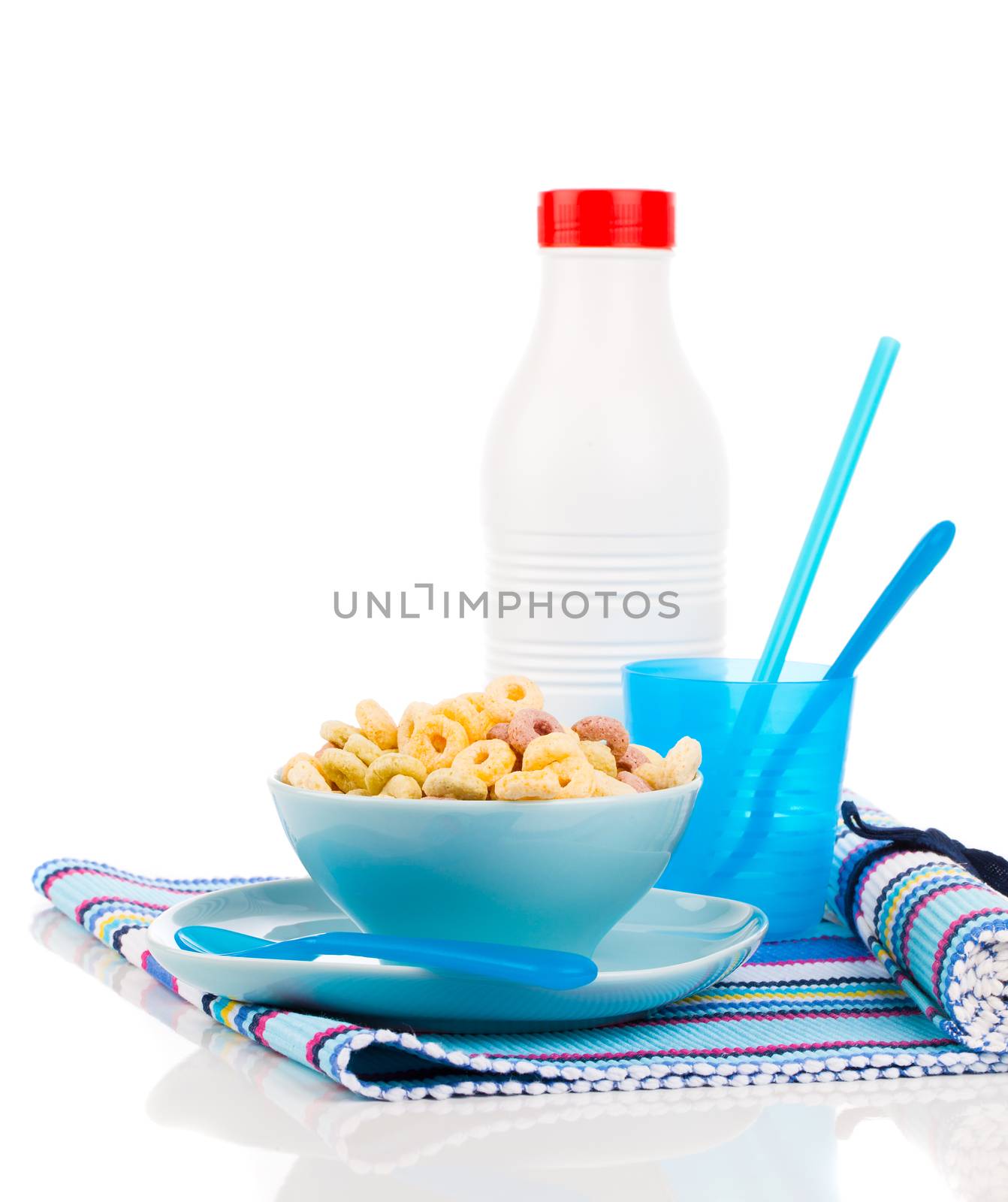 Delicious Cheerios Oat Cereal in bowl with bottle milk by motorolka