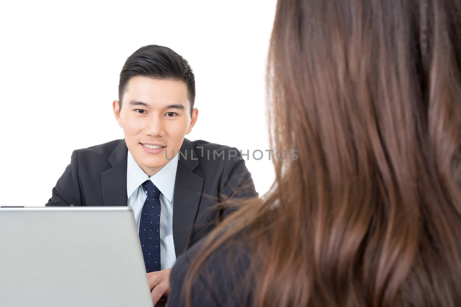 Asian young business man consulting with a woman, closeup portrait.