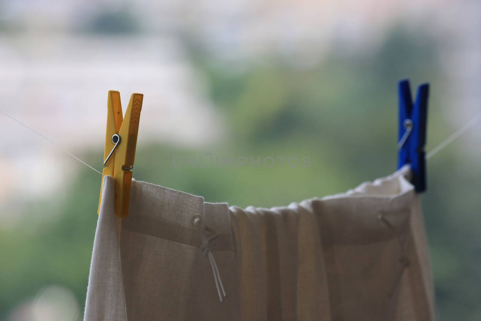 Plastic laundry clips holding skirt on the terrace