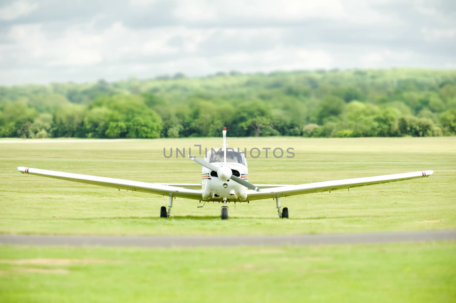 light aircraft on a grass airstrip