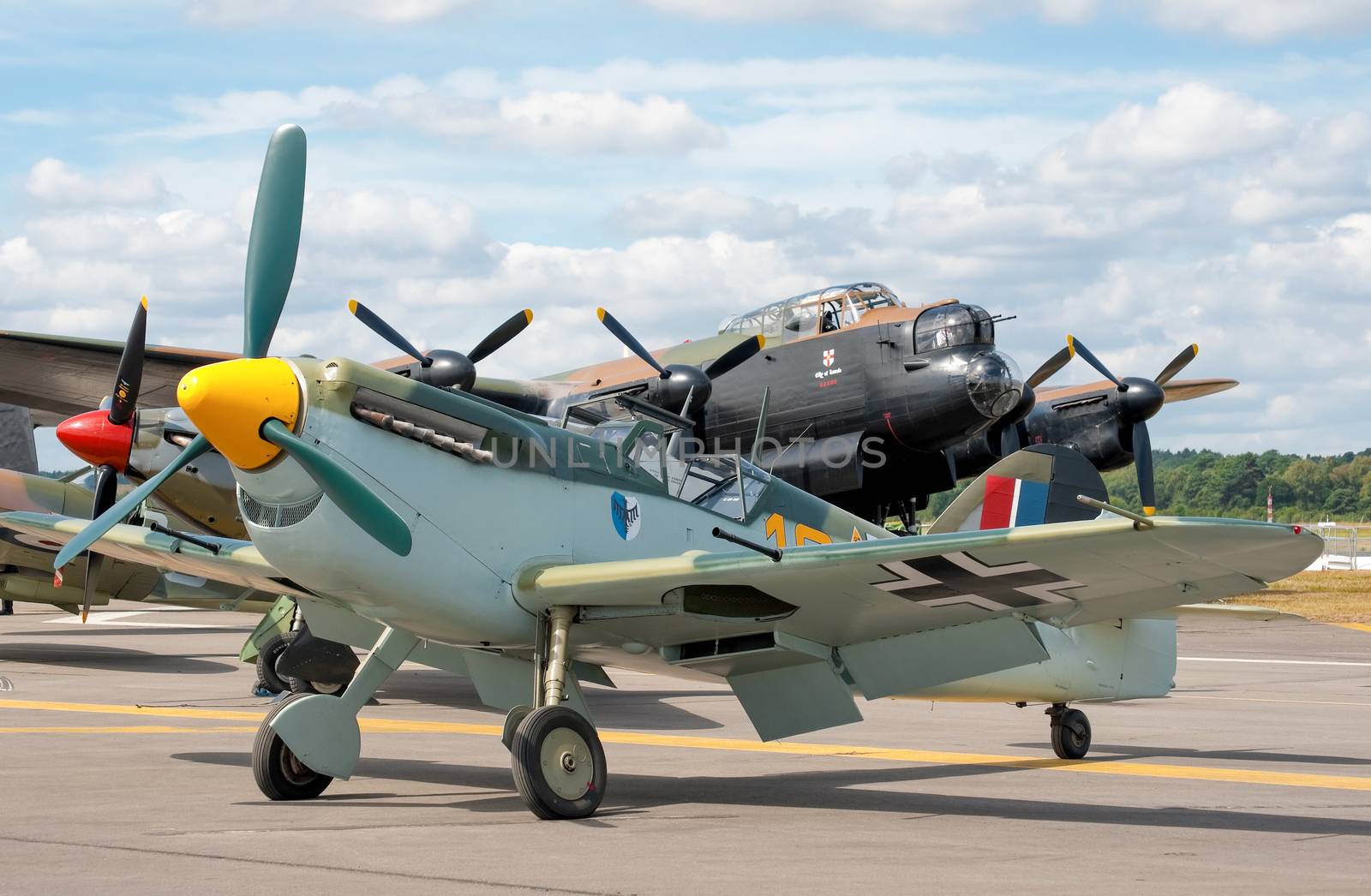 Farnborough, UK - July 24, 2010: WW2 military rivals, the  Messerschmitt BF-109 and the last airworthy Lancaster Bomber at the Farnborough Airshow, UK