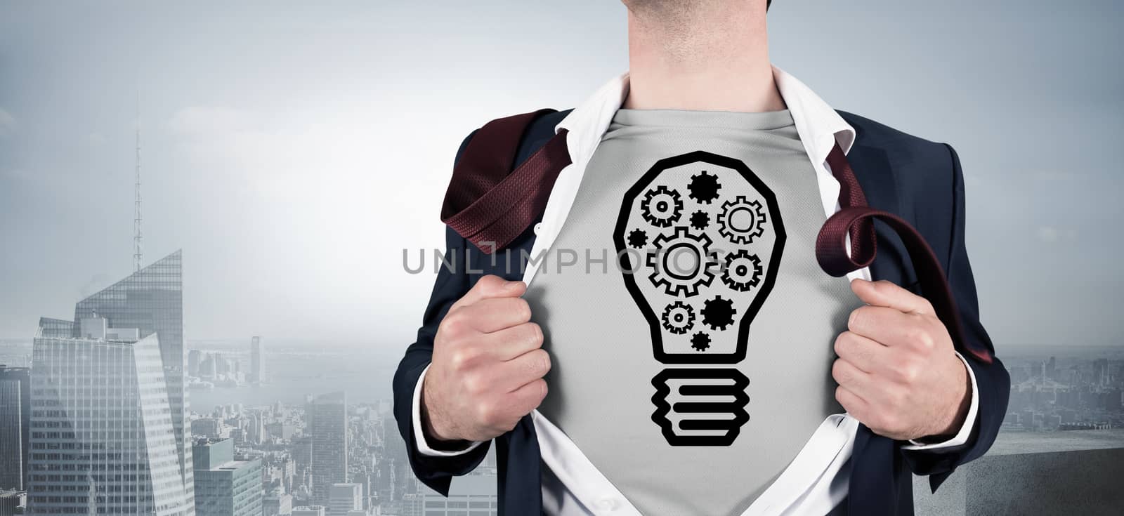 Businessman opening shirt in superhero style against misty cityscape