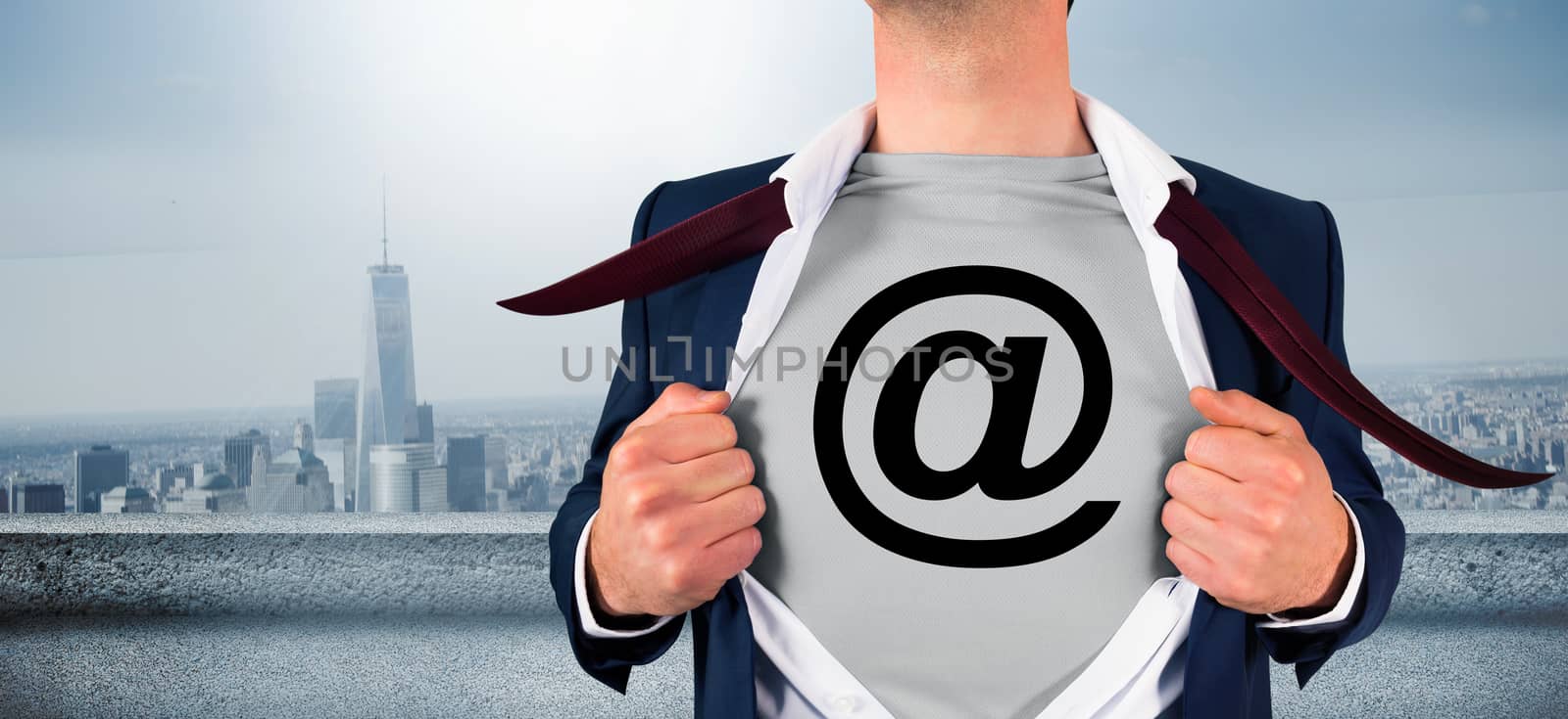 Composite image of businessman opening shirt in superhero style by Wavebreakmedia