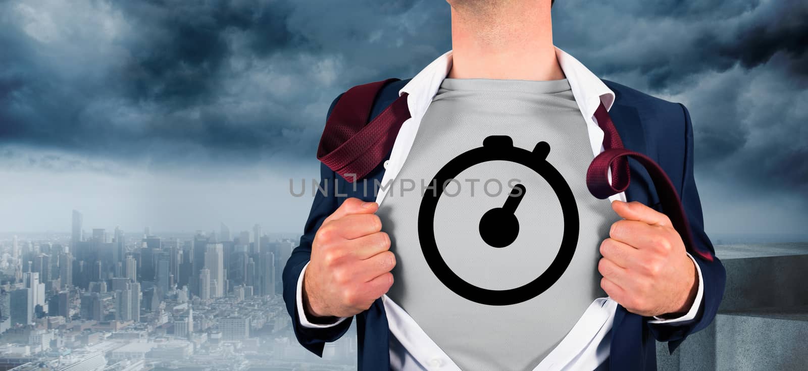 Businessman opening shirt in superhero style against coastline and city