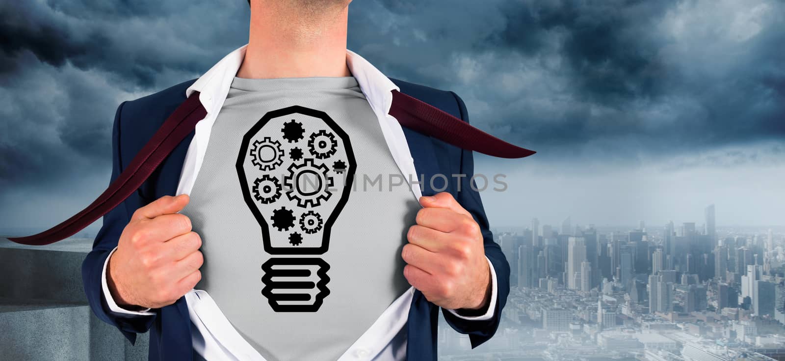 Businessman opening shirt in superhero style against coastline and city