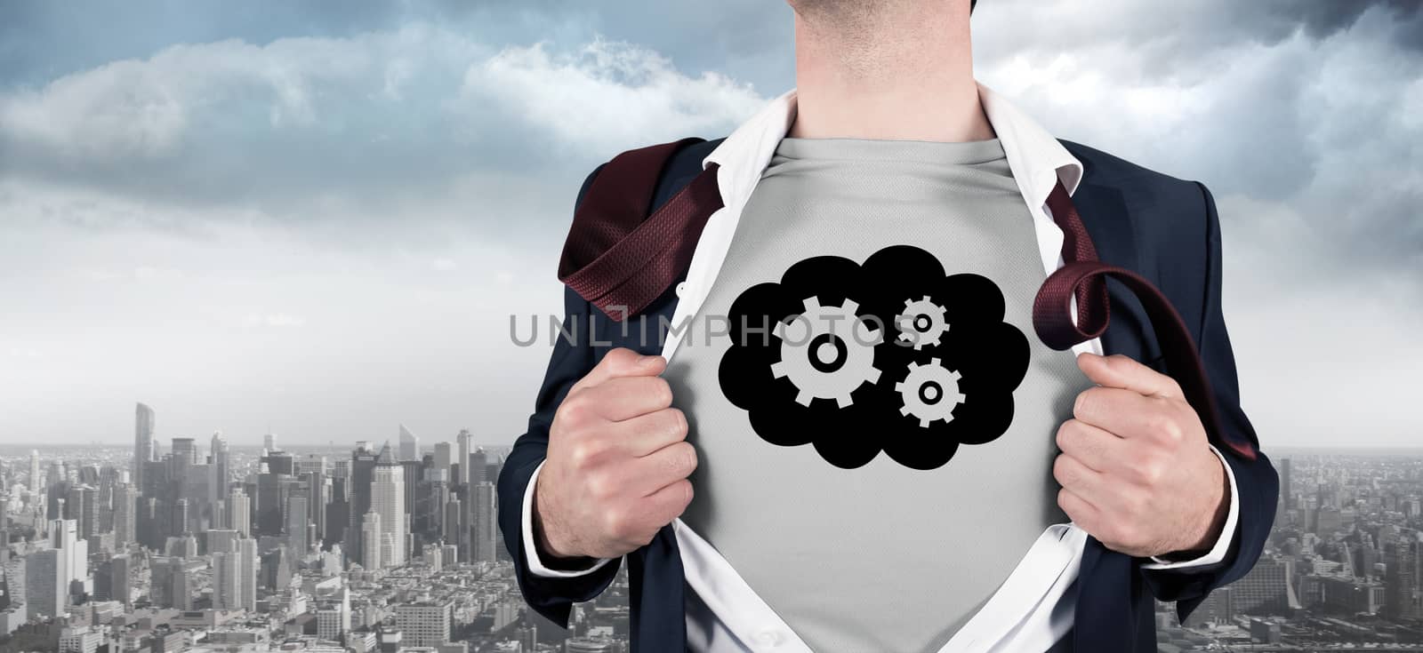 Composite image of businessman opening shirt in superhero style by Wavebreakmedia