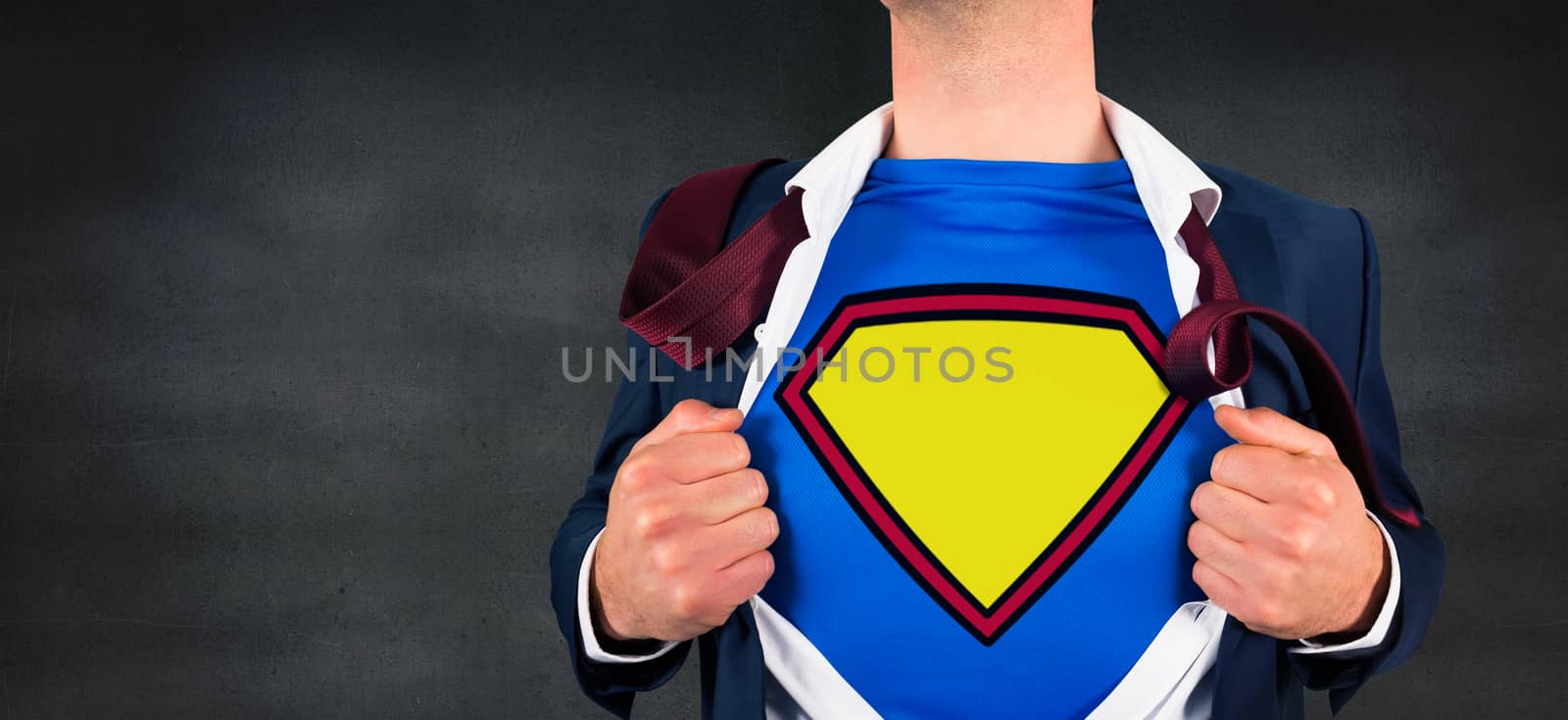 Composite image of businessman opening shirt in superhero style against black wall