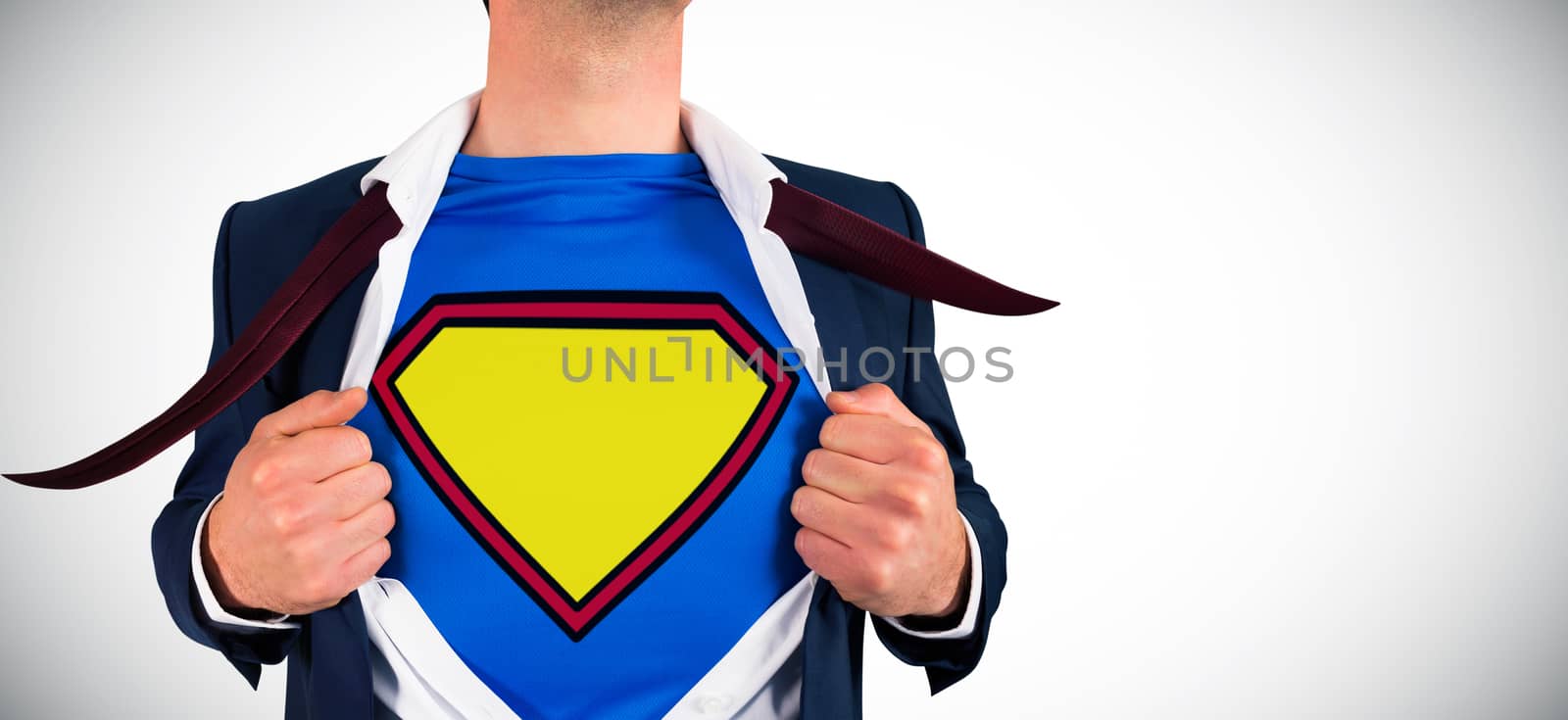 Businessman opening shirt in superhero style against white background with vignette