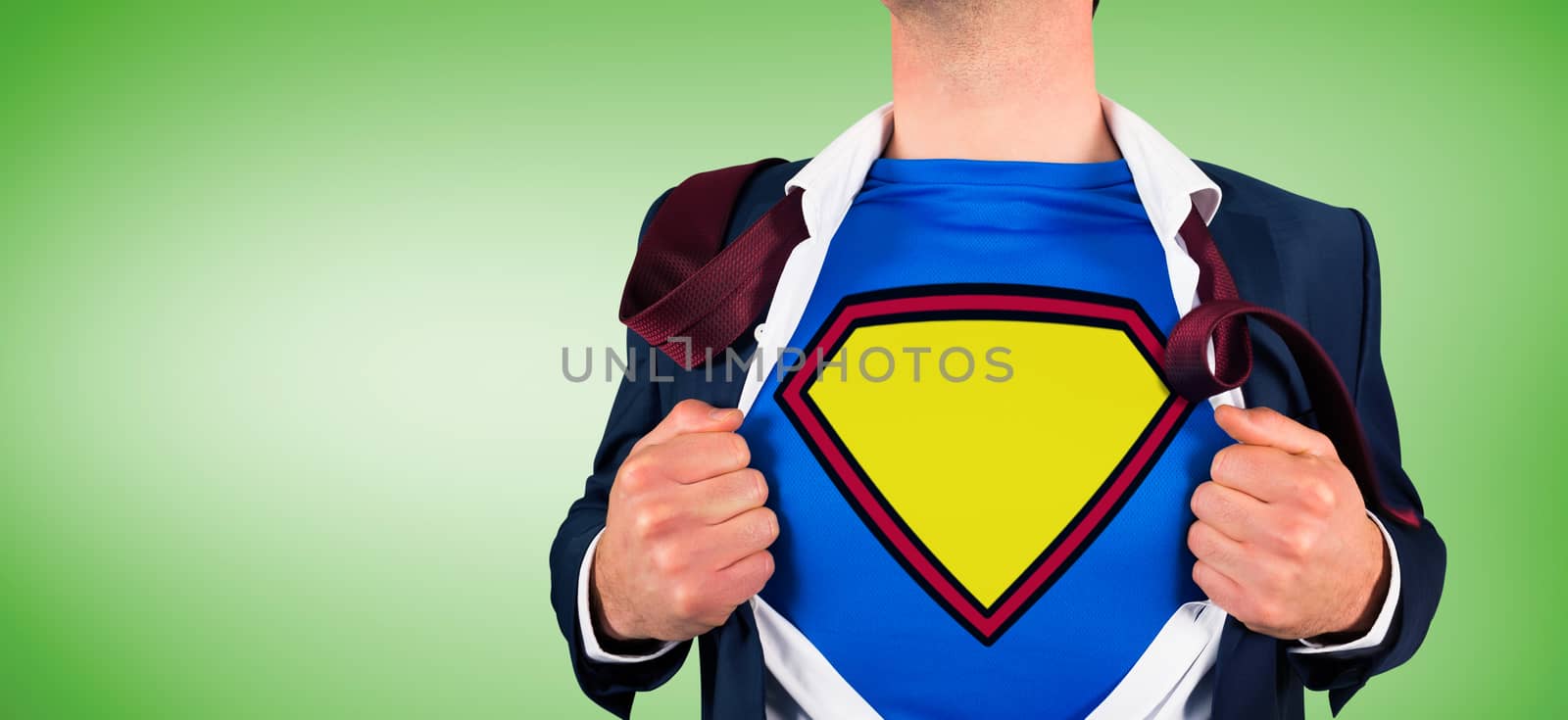 Businessman opening shirt in superhero style against green vignette