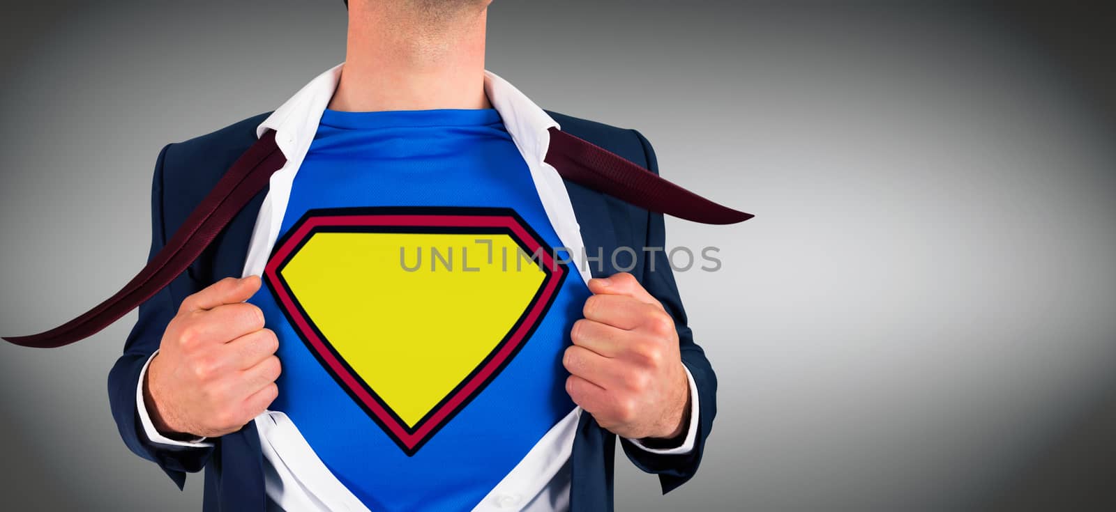 Composite image of businessman opening shirt in superhero style by Wavebreakmedia