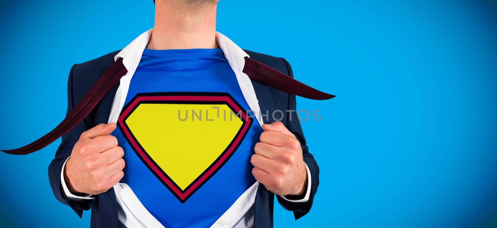 Composite image of businessman opening shirt in superhero style by Wavebreakmedia