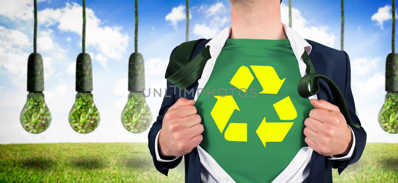 Composite image of businessman opening shirt in superhero style by Wavebreakmedia