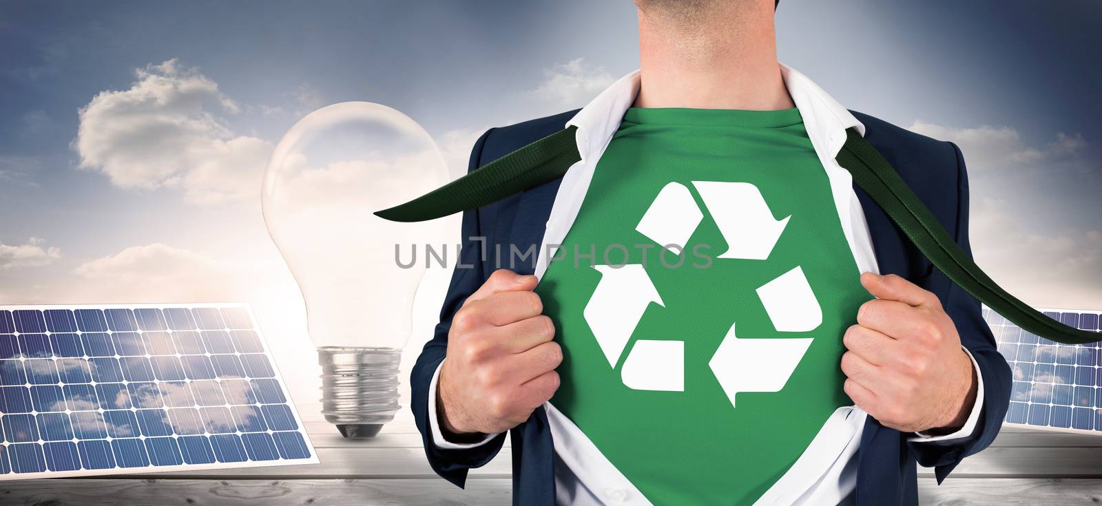 Composite image of businessman opening shirt in superhero style by Wavebreakmedia