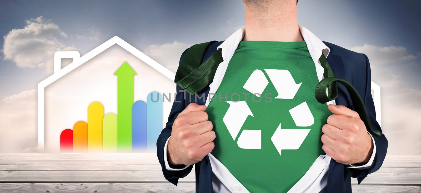 Businessman opening shirt in superhero style against diagram of a house with energy rating chart 