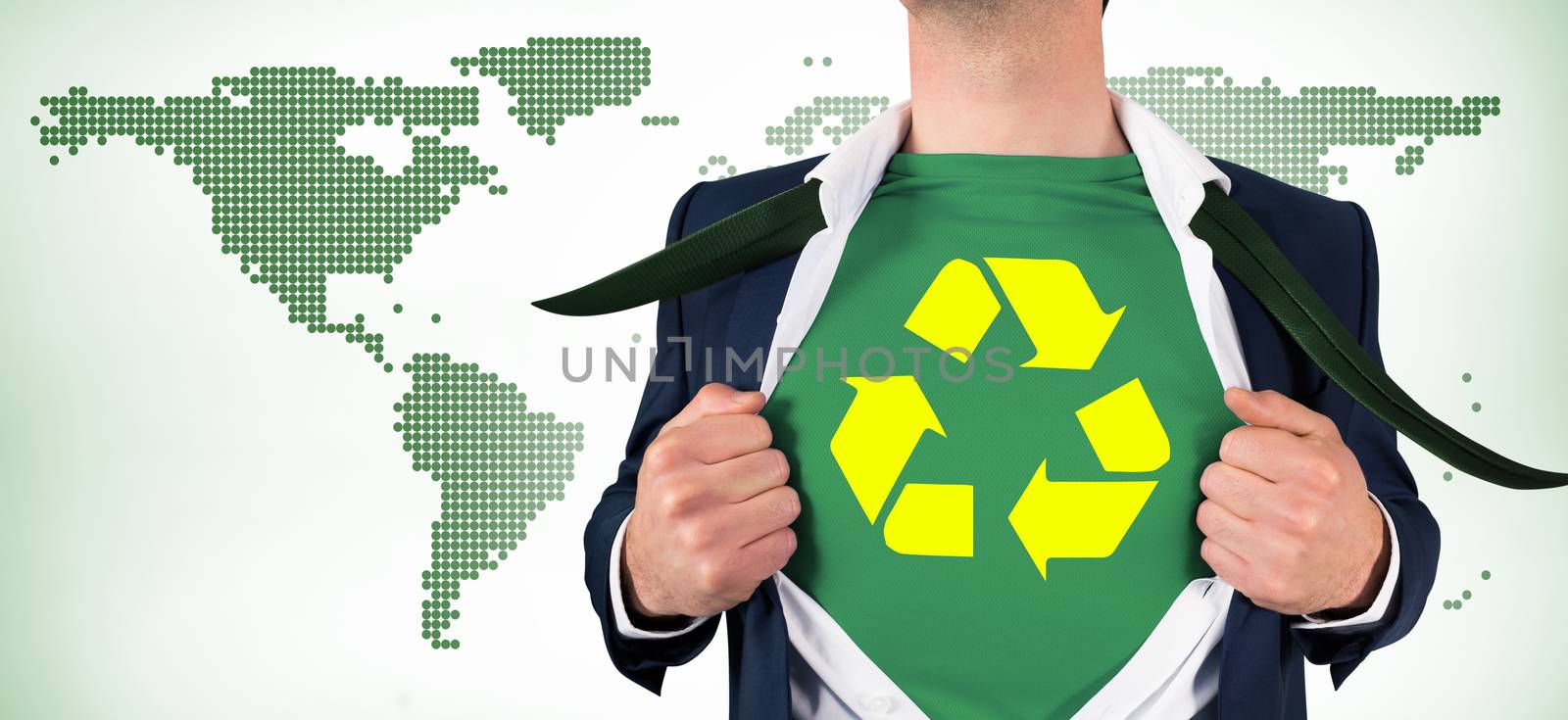 Businessman opening shirt in superhero style against green world map on white background
