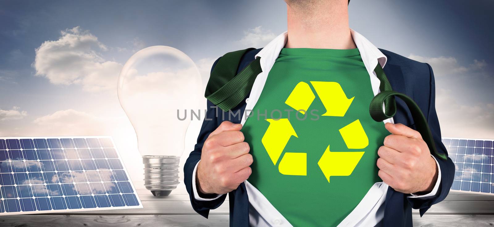 Composite image of businessman opening shirt in superhero style by Wavebreakmedia