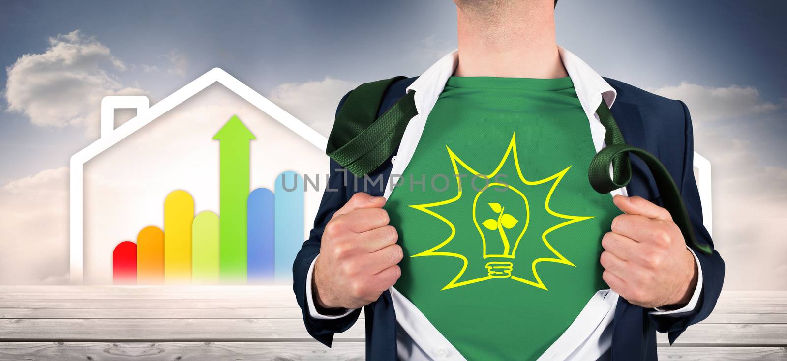 Businessman opening shirt in superhero style against diagram of a house with energy rating chart 
