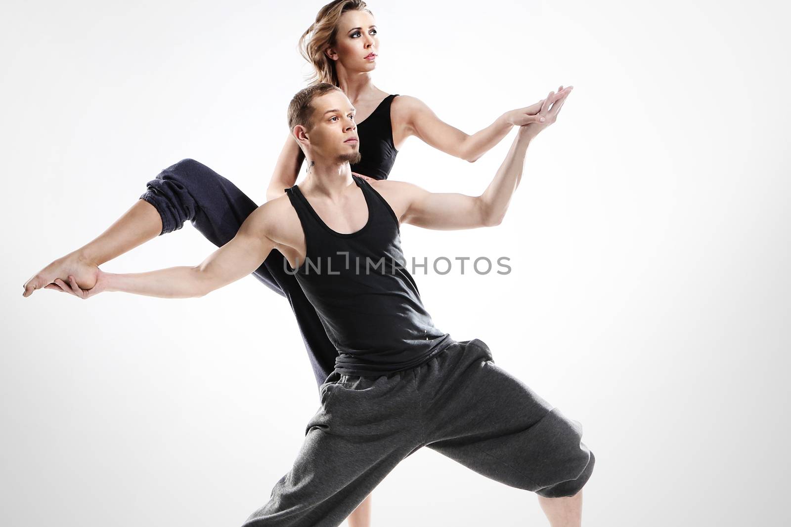 A couple of young dancers in a dynamic pose
