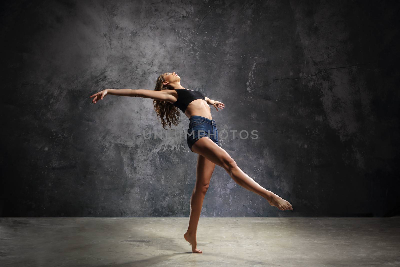 Attractive young dancer dancing modern dance