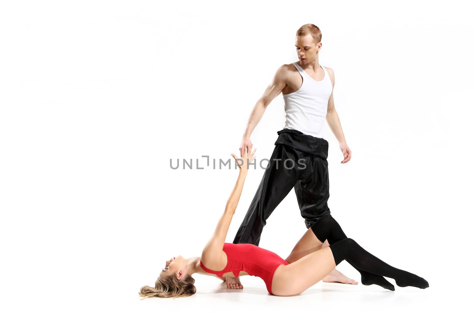 Couple in a pose of modern dance woman wearing a sexy outfit