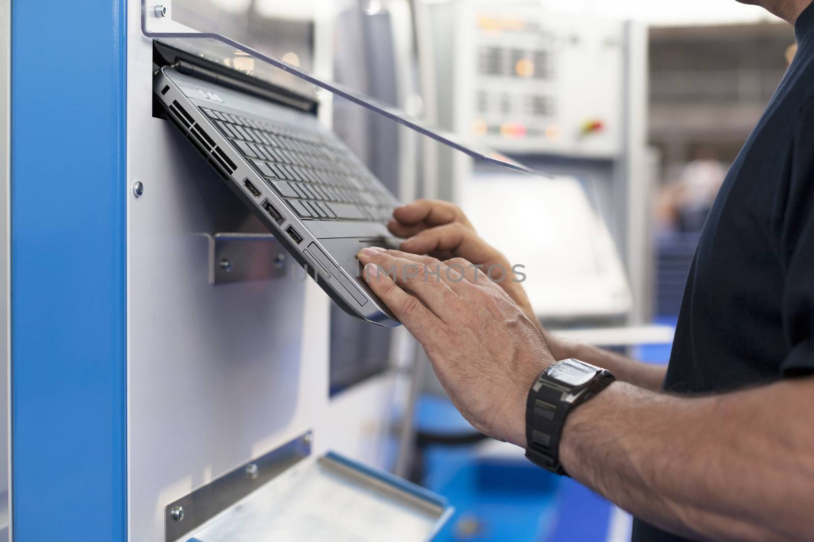 Man working at programmable machine