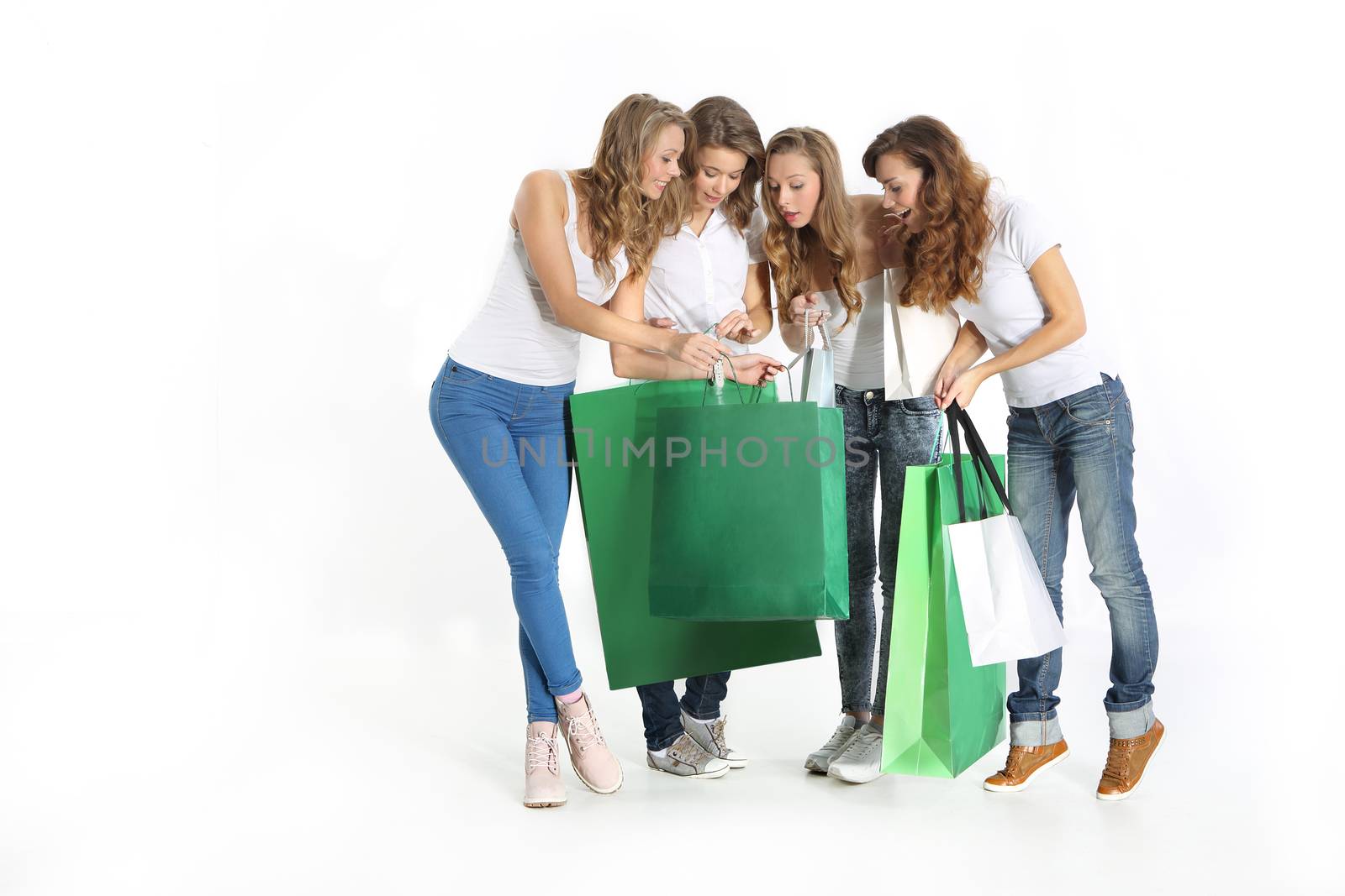 Group of the beautiful girlfriends shopping together
