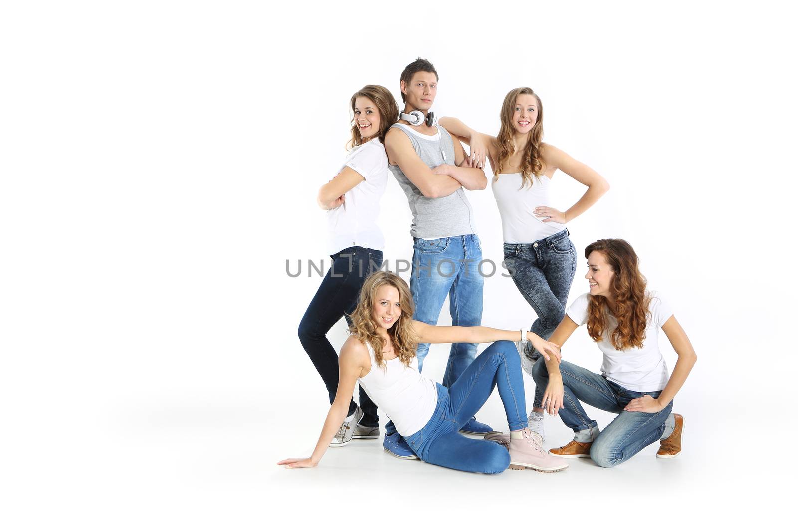 The team of young people three girls and a boy stand on a white background