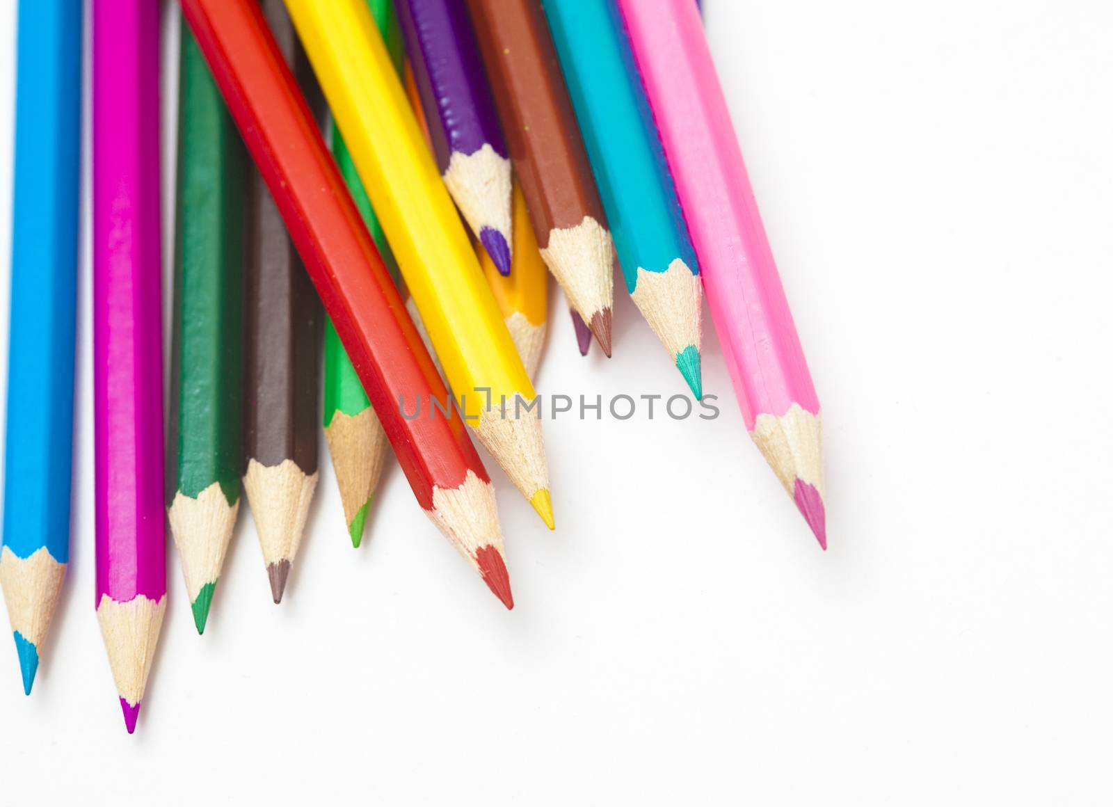 colored pencils on a white background