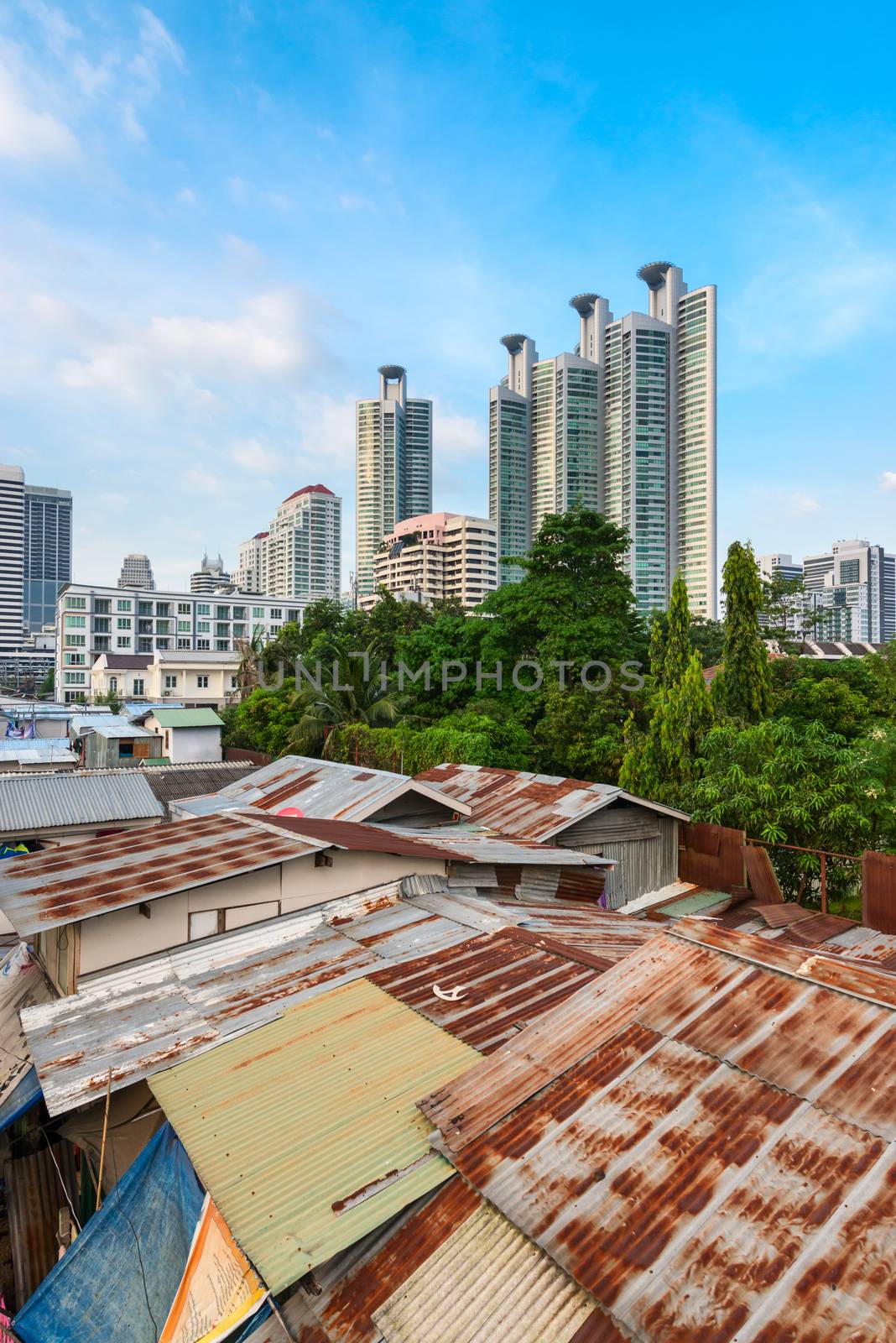 Modern asian city discord with shacks and skyscrapers by iryna_rasko