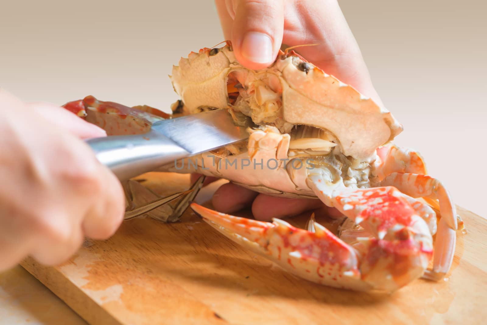 Fresh boiled crab dressing process on wooden board