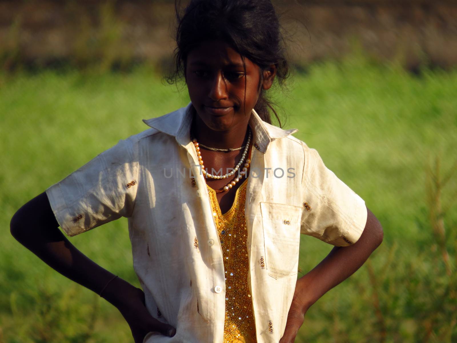 A poor girl in India lost in her thoughts thinking what to do