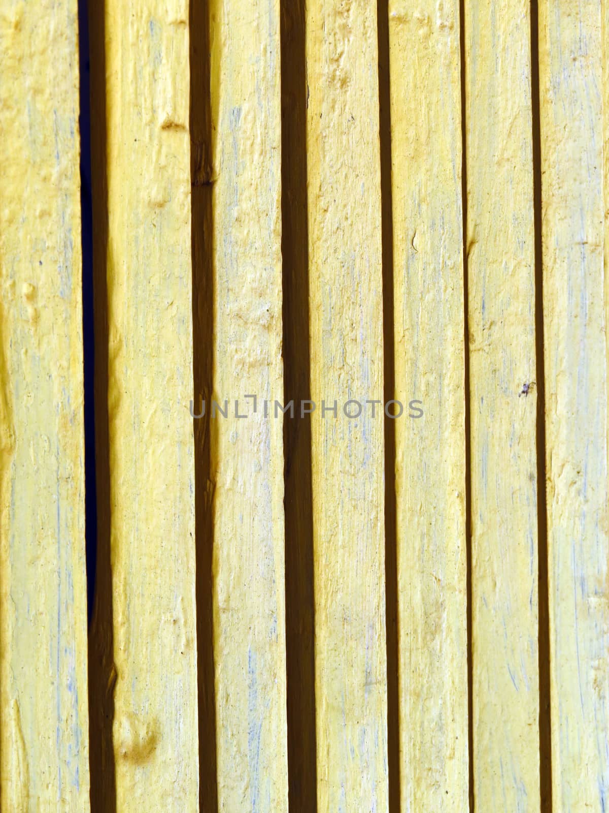 A background of a window grills made of wooden planks in an old Indian village house.                               