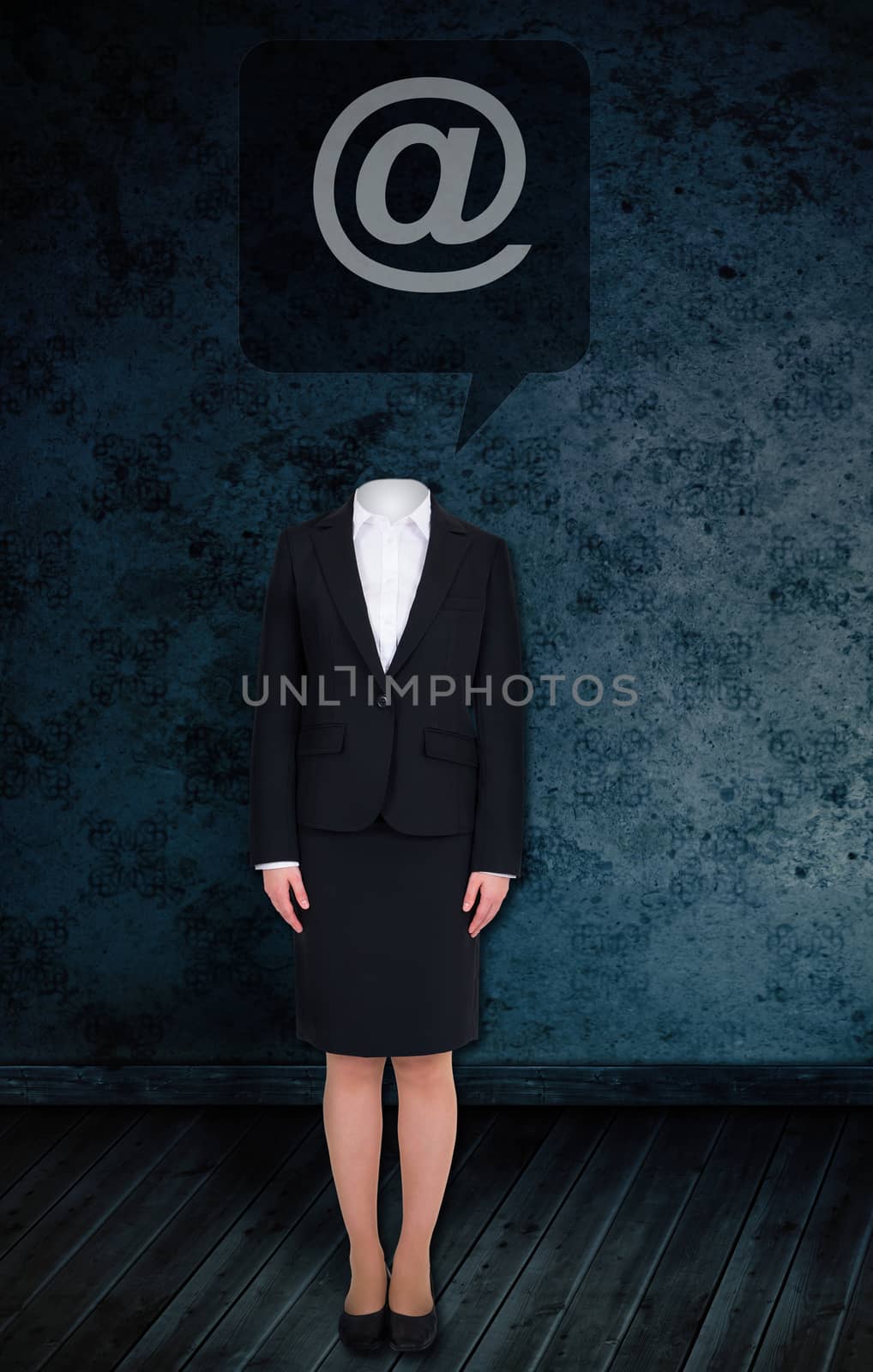 Composite image of headless businesswoman with at sign against dark grimy room