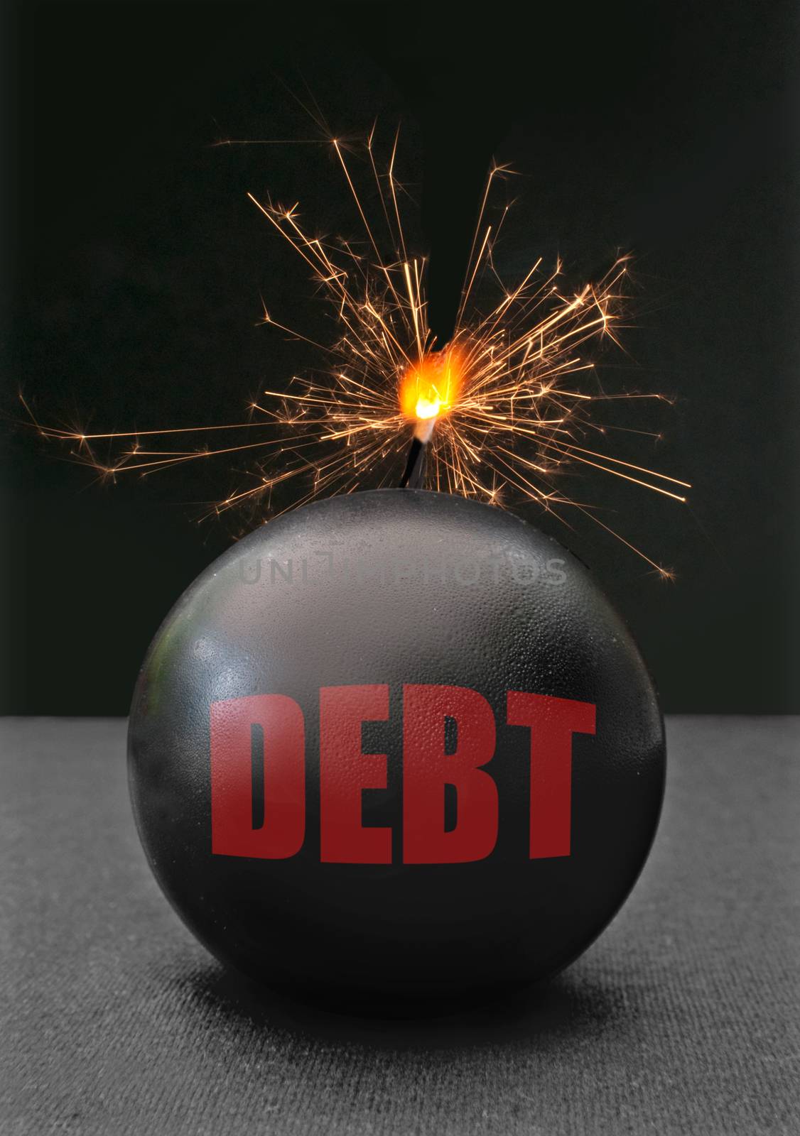 Exploding bomb labeled debt with burning fuse 