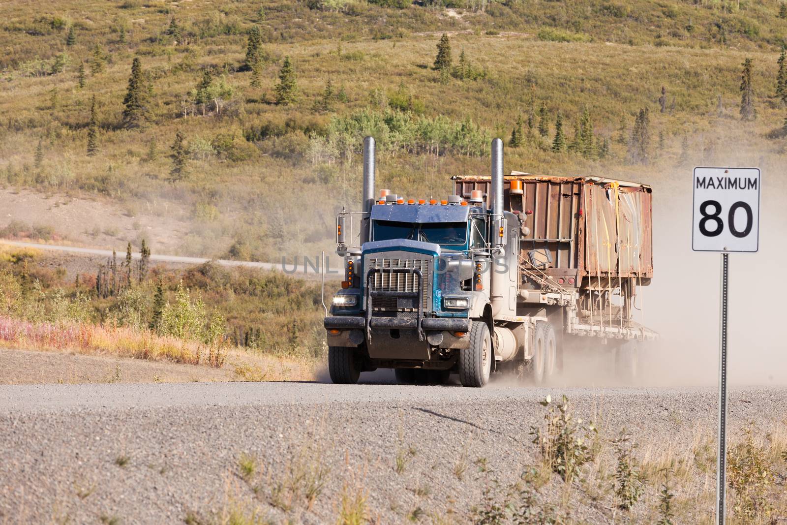 Industrial truck driving dusty rural dirt road by PiLens